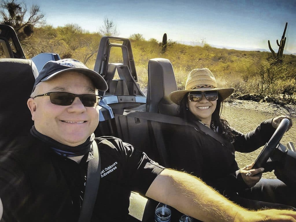 Man and woman in a Slingshot