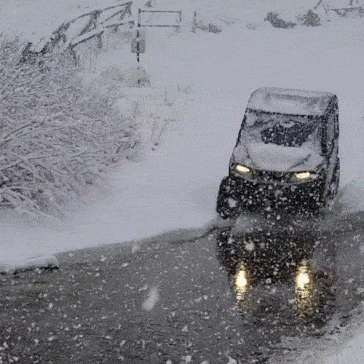 UTVs running thru water