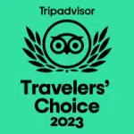 TripAdvisor logo with an owl, surrounded by laurels, and text "Travelers' Choice 2023" on a teal background.